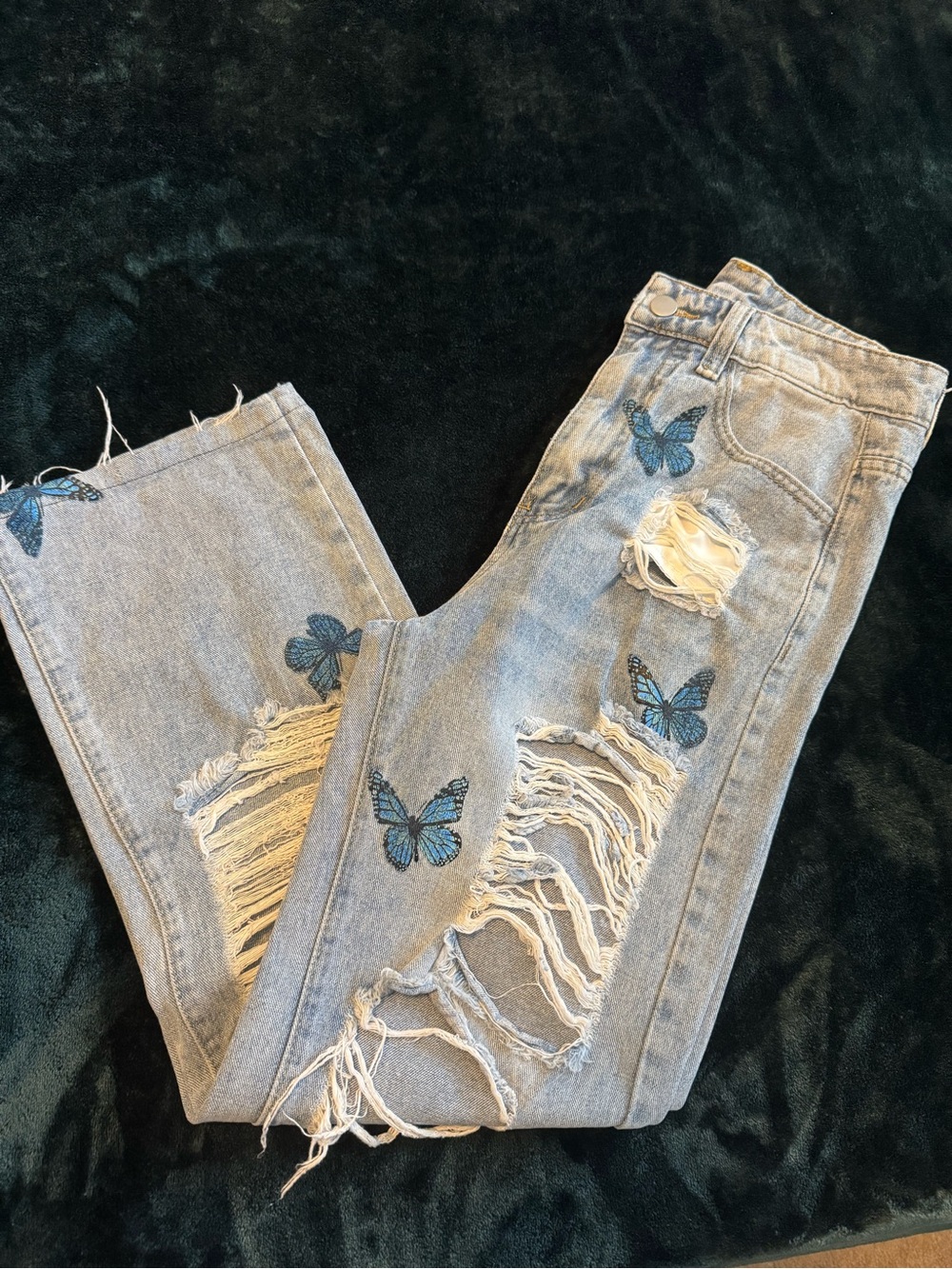 Blue butterfly ripped jeans